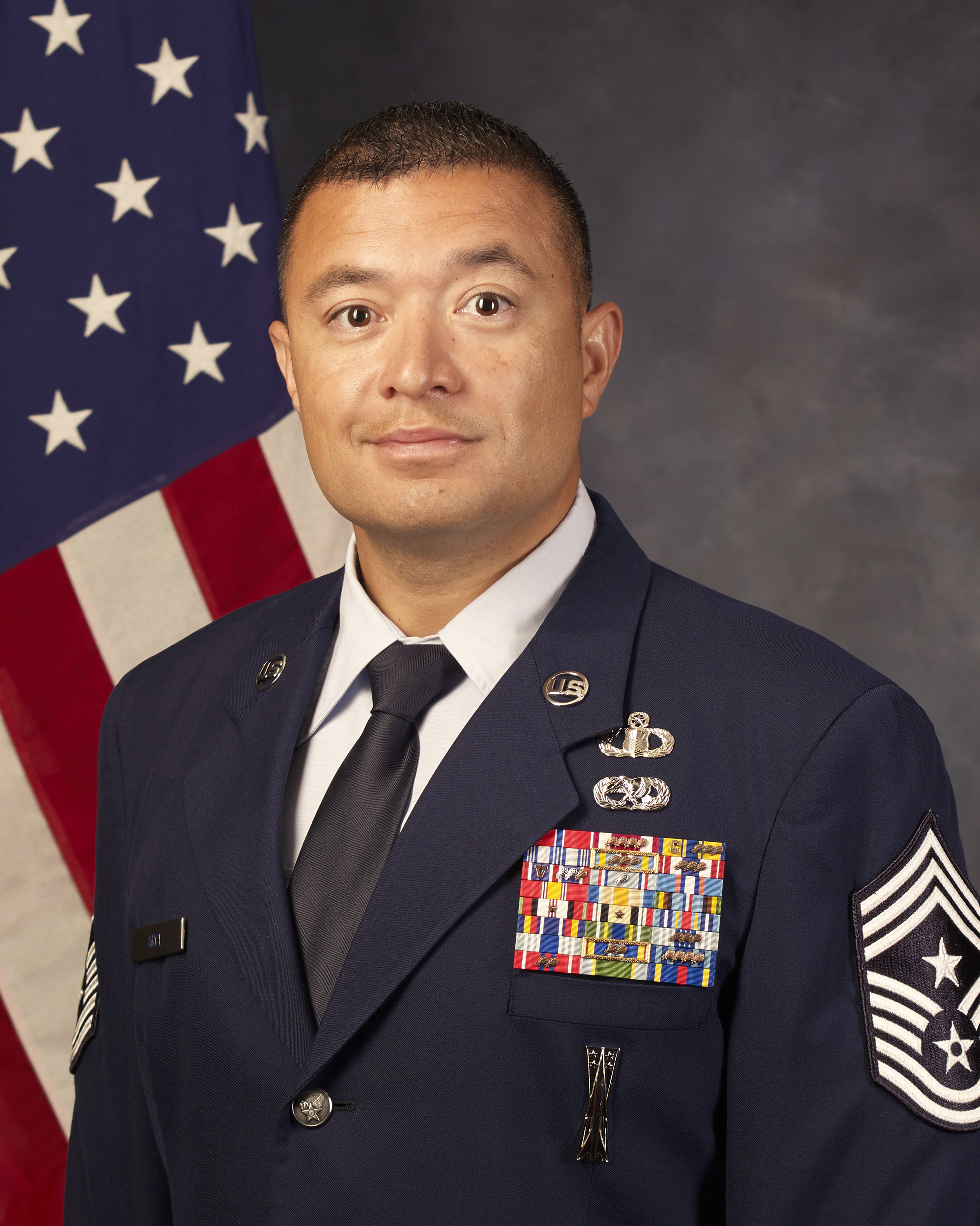 Chief Master Sgt. Joseph Arce official photo with American flag background