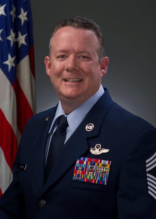 62 OG Commander official photo with American flag background