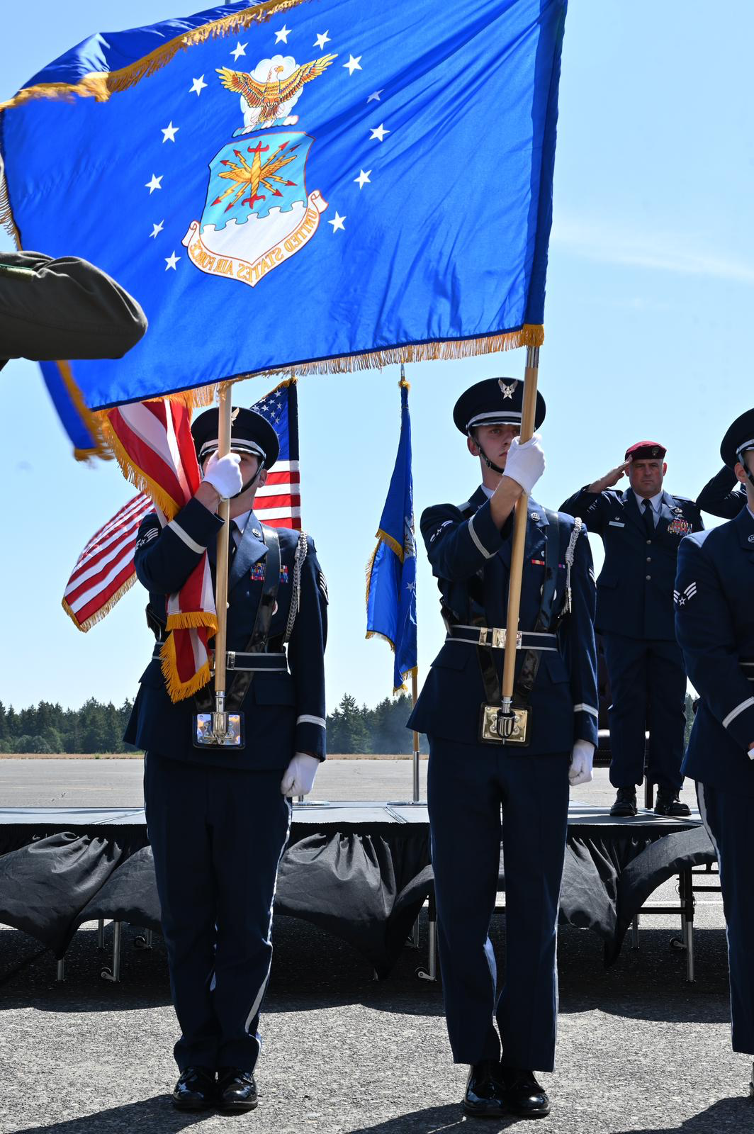 A McChord Field honor guard color team presents the American flag and Air Force flag during a ceremony