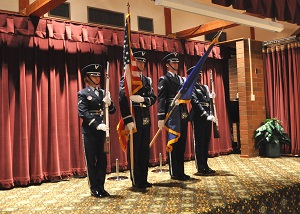 A McChord Field honor guard color team presents the American flag and Air Force flag during a ceremony