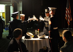 An honor guard team performs a POW/MIA Table Ceremony